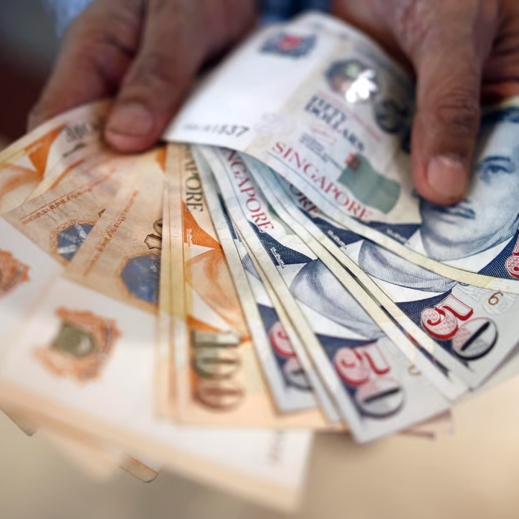 Singapore dollar notes showing cost savings with serviced offices for rent in Singapore.